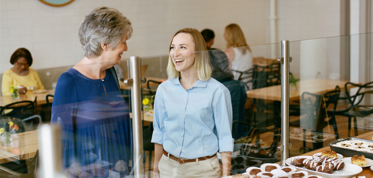 Carer with Client and Cafeteria